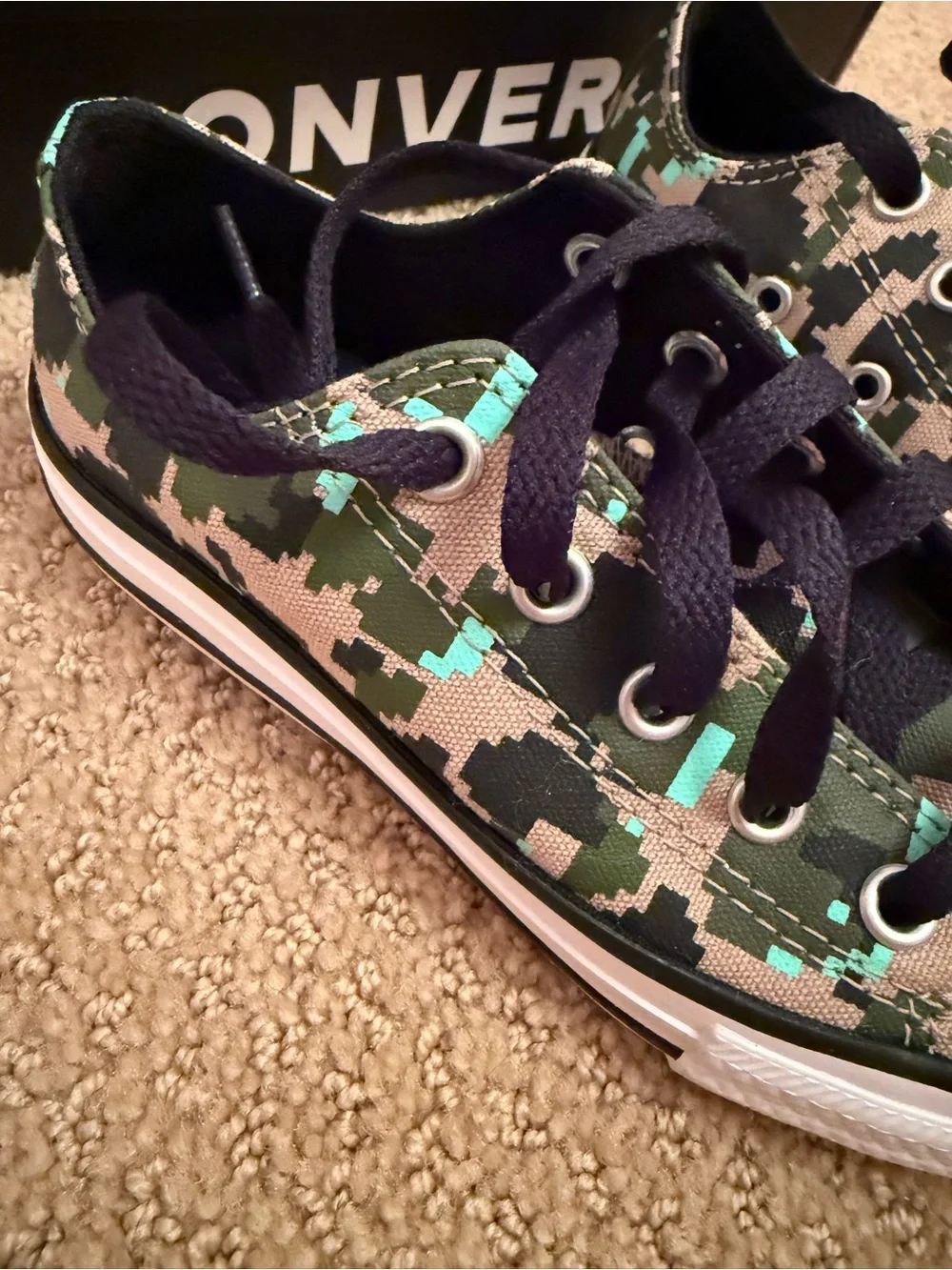 New in box. Converse low sneakers. Size 12